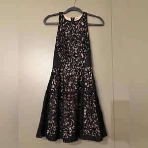 Black lace over nude dress